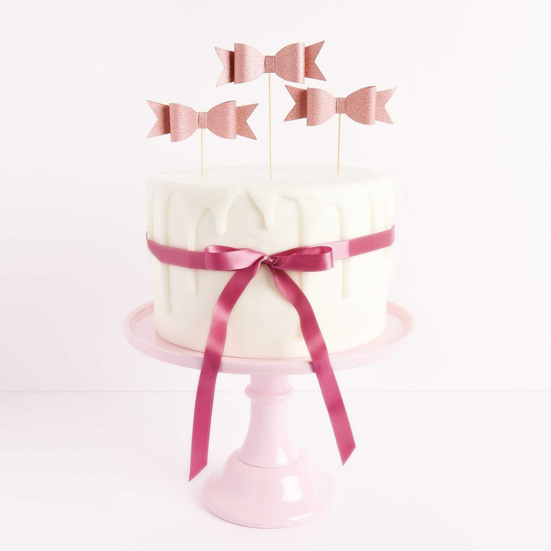 Taarttopper roze glitter strikjes 6 stuks